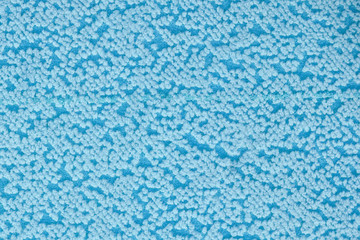 Fototapeta na wymiar Fabric texture with spots. Textile material background with abstract pattern, close up. Carpet texture with blue dots.
