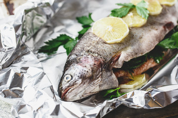 Raw rainbow trout in foil