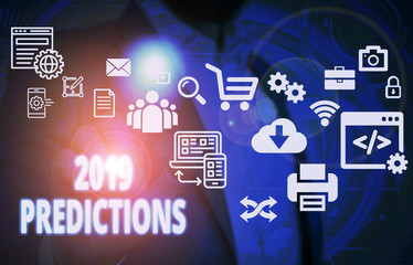 Naklejka premium Handwriting text 2019 Predictions. Conceptual photo statement about what you think will happen in 2019 Male human wear formal work suit presenting presentation using smart device