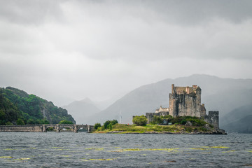 Fototapeta na wymiar Magnificent Eilean Donan castle during cloudy weather at low tide