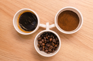 Three types of coffee - ground, grain, beverage 