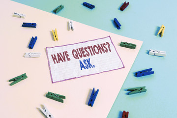 Conceptual hand writing showing Have Questions Question Ask. Concept meaning asking someone respond you with feedback Colored clothespin paper reminder with yellow blue background