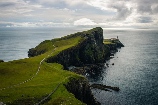 Famous lighthouse on isle of Skye in Scotland, Point nest, view over the approaching path, over the green meadow