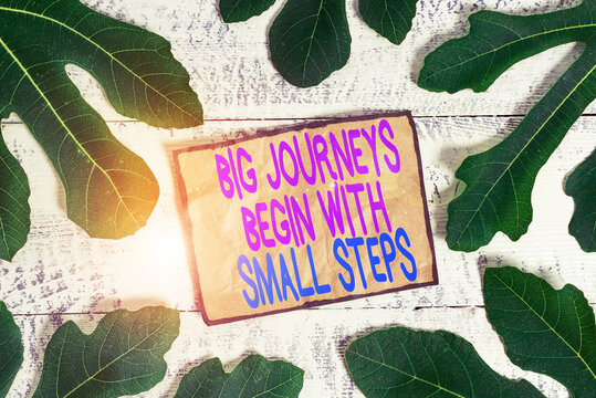 Writing note showing Big Journeys Begin With Small Steps. Business concept for One step at a time to reach your goals