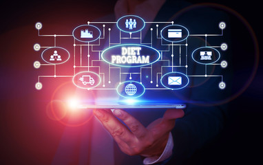 Conceptual hand writing showing Diet Program. Concept meaning practice of eating food in a regulated and supervised fashion Male wear formal suit presenting presentation smart device