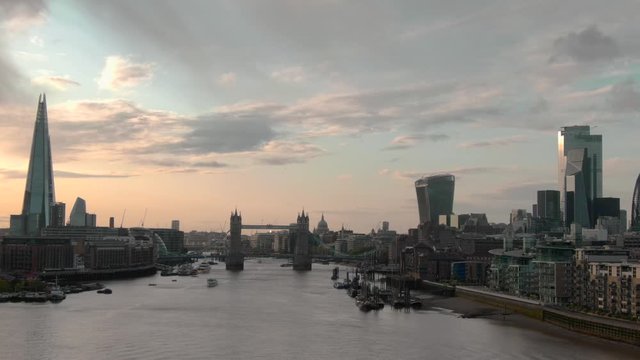 Aerial view of City of London Skyline, The Shard, Tower Bridge and Thames River at sunset in London