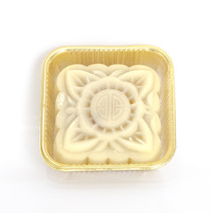 Studio shot one snowskin moon cake in transparent airtight packaging isolated on white
