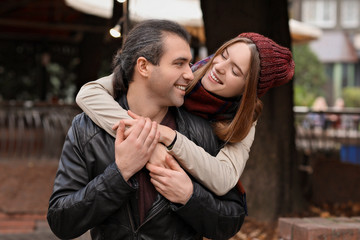 Fototapeta premium Happy couple walking in autumn city