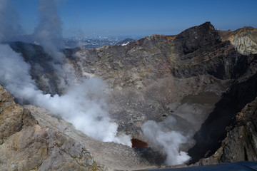 Panoramic view of the city Petropavlovsk-Kamchatsky and volcanoes: Koryaksky Volcano, Avacha Volcano, Kozelsky Volcano. Russian Far East, Kamchatka Peninsula.