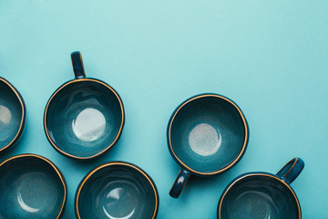 Set of clean cups on color background.