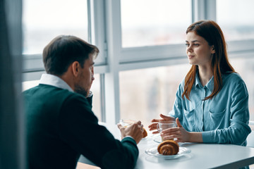 man and woman talking on the phone