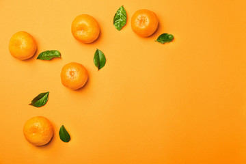 Sweet tangerines on color background