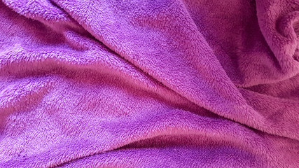 Fototapeta na wymiar Top view of winter purple blanket with wrinkles