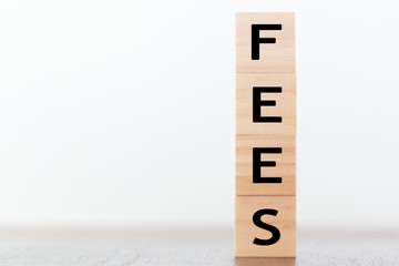 Fees word written on wooden cubes