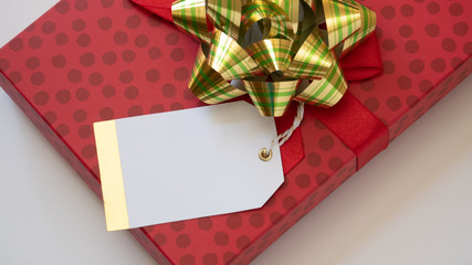 Holiday package wrapped with blank tag