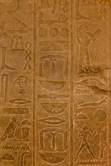 Egyptian ancient hieroglyphs on the stone wall