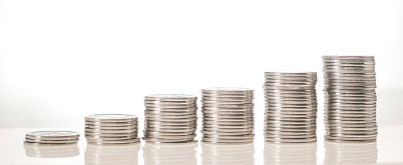 stack of coins isolated on white background incomes are rising