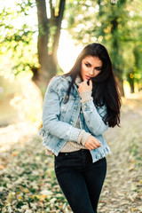 Beautiful model posing for the camera in the park.