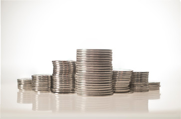 stack of coins isolated on white background incomes are rising