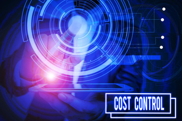 Fototapeta premium Text sign showing Cost Control. Business photo showcasing practice of identifying and reducing business expenses Male human wear formal work suit presenting presentation using smart device