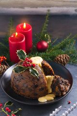 Christmas pudding decorated with sprig of holly. Cristmas decorations