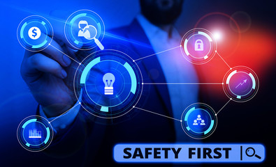 Word writing text Safety First. Business photo showcasing said to mean that it is best to avoid any unnecessary risks Male human wear formal work suit presenting presentation using smart device