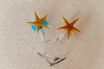 Fototapeta na wymiar Champagne glass decorated with seashell and sea star