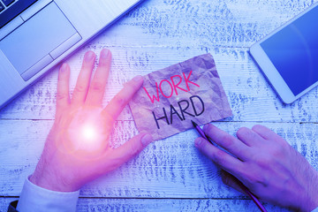 Handwriting text writing Work Hard. Conceptual photo Laboring that puts effort into doing and...