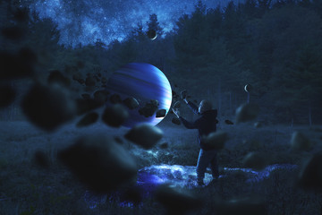 Man collecting rocks around a planet