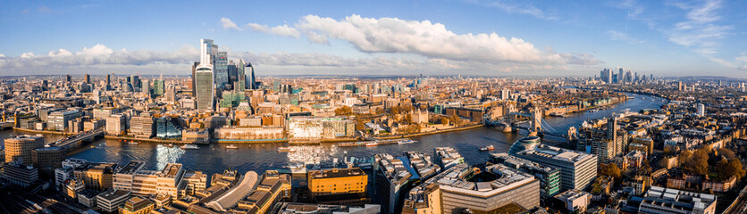 Panoramic aerial view of London, UK. Beautiful skyscrapers, river Thames and railway going through...