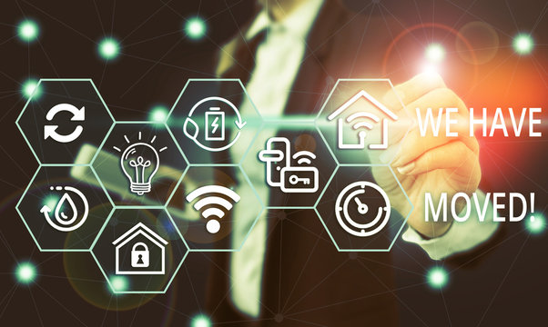 Text sign showing We Have Moved. Business photo showcasing To go from one residence or location to another Relocate Female human wear formal work suit presenting presentation use smart device