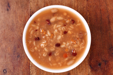 Eight treasure porridge on white wooden table  