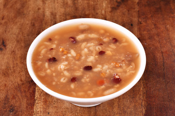 Eight treasure porridge on white wooden table  