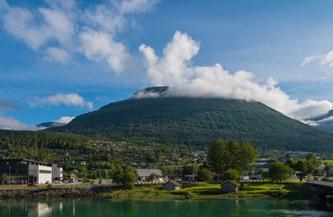 Naklejka premium Sunset over river Stryneelva and Loen village at Stryn, Norway, july 2019.