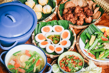 Thai traditional food full course with good decorate Boiled Eggs with fish suace and chilli and garlic, Thai name is 