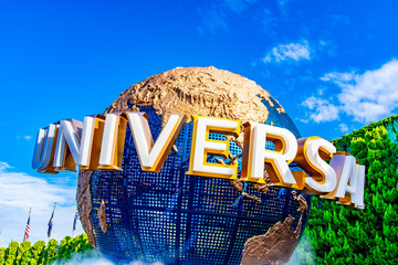 OSAKA, JAPAN - AUGUST 12, 2018: Tourists and theme park visitors front of rotating globe fountain in front of Universal Studios. Universal Studios Japan is a fun and famous theme park in Osaka, Japan.