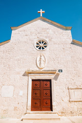 Saint George church on hill in Primosten, Croatia