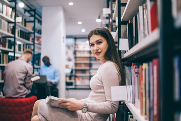 Pretty woman reading book and enjoying story