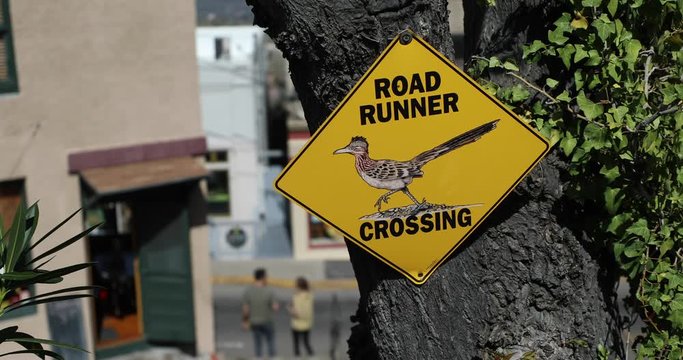 An old vintage sign in Arizona says "road runner crossing".