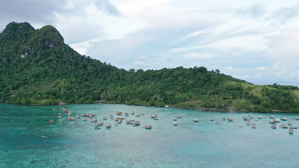 Fototapeta na wymiar Aerial view beautiful landscape, island and blue ocean in Semporna, Sabah, Malaysia also the home of nomadic sea gypsy.