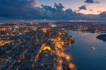 Aerial view of Valletta, Malta with Basilica of Our Lady of Mount Carmel at sunset