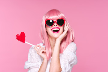 portrait of a girl in glasses with lollipop