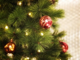 Christmas tree decorated with beautiful ornaments and lighting. garland background and xmas wallpaper.christmas decoration on tree.