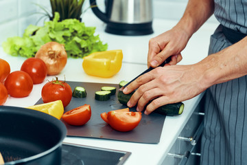 woman cutting vegetables in the kitchen