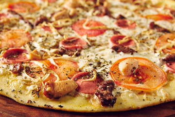 Pizza on wooden table side view