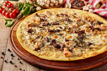 Mushroom pizza on wooden table