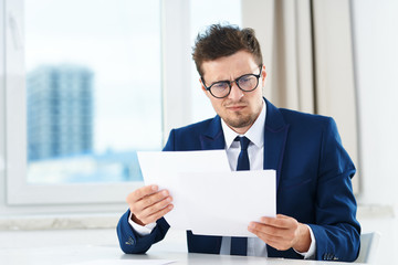 businessman holding a blank card