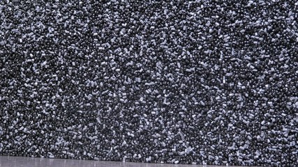 Plastic black gray granulated crumb. Manufacture of plastic water pipes of the factory. Process of...
