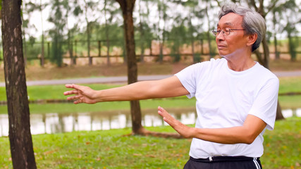 Naklejka premium Asian man doing streching at the park.