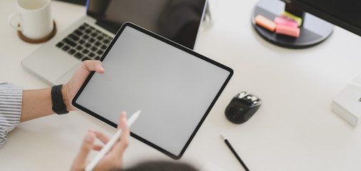 Cropped shot of young professional UX web developer working on smartphone template